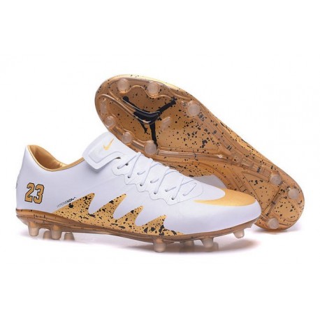 white and gold soccer boots