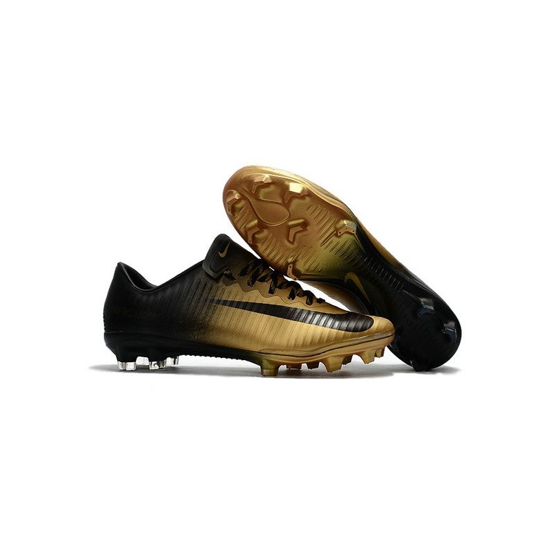 nike football boots black and gold