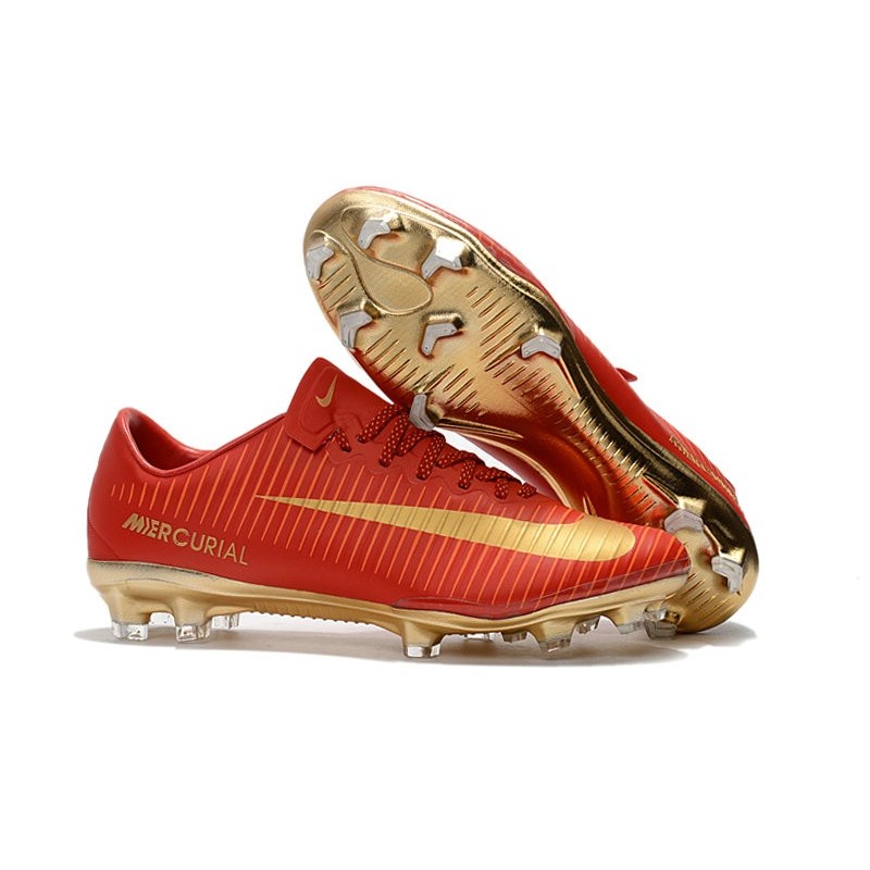 gold and red football cleats