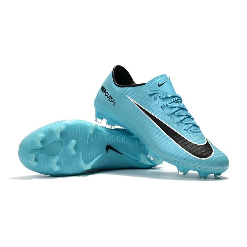blue and black soccer shoes