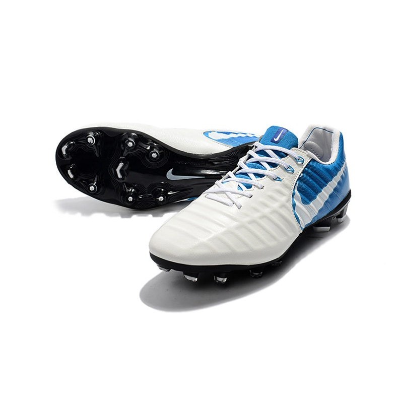 white and blue nike tiempo