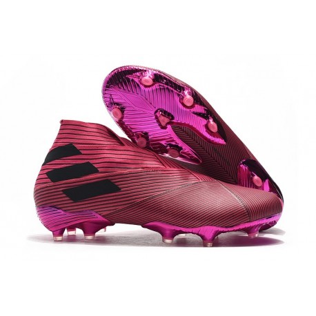 pink and white soccer cleats